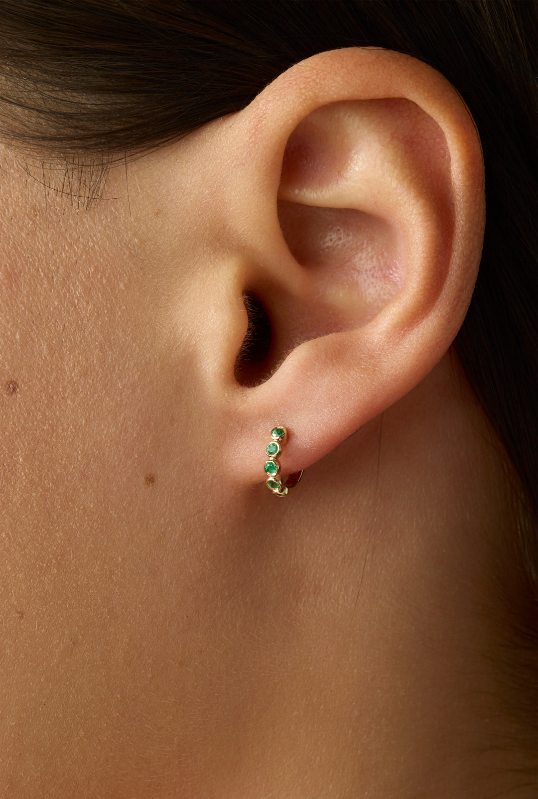 14KY Emerald Bezel Huggies